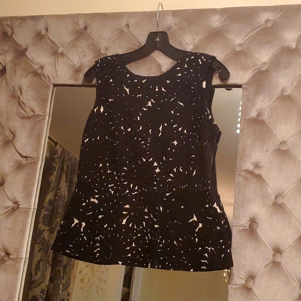 Ann Taylor Black Peplum top with white pattern.